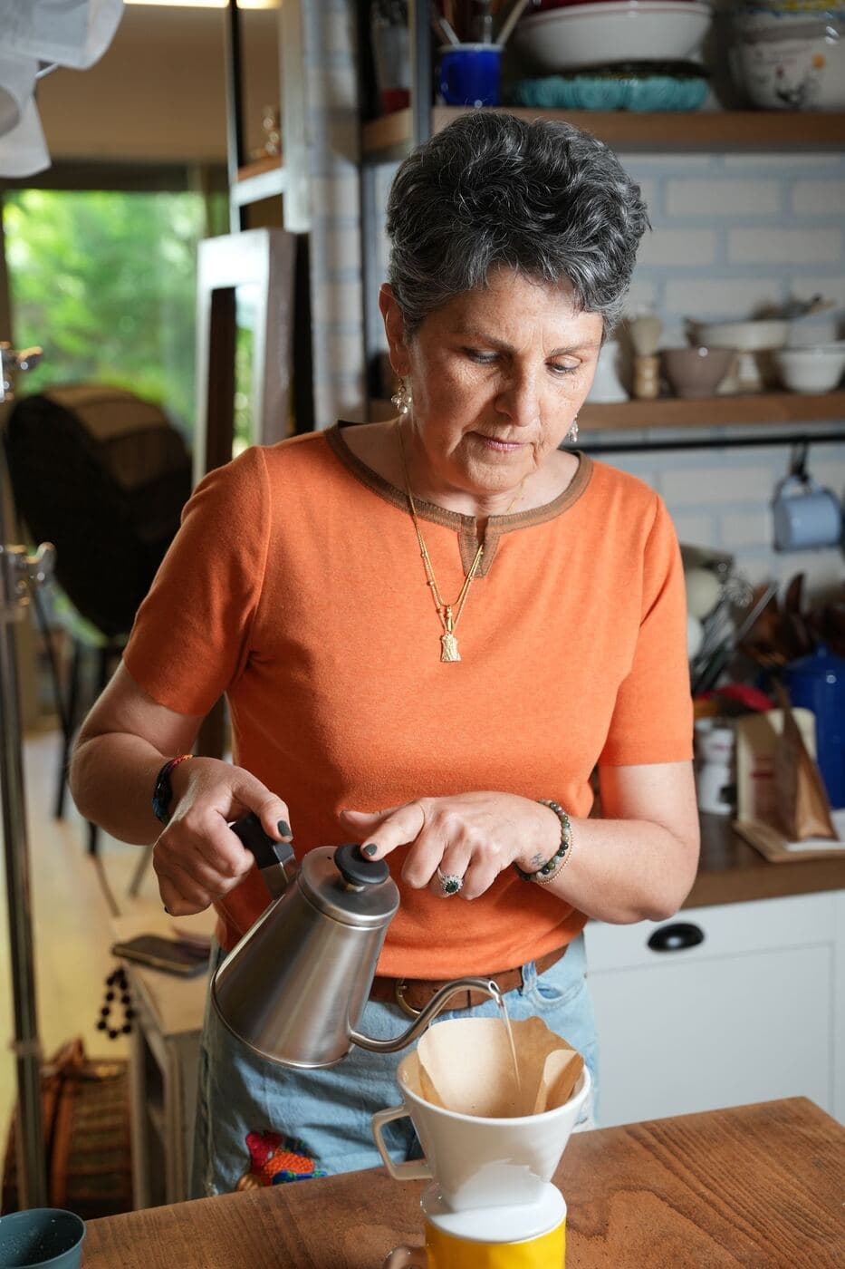 Person enjoying a quiet morning coffee before starting their day