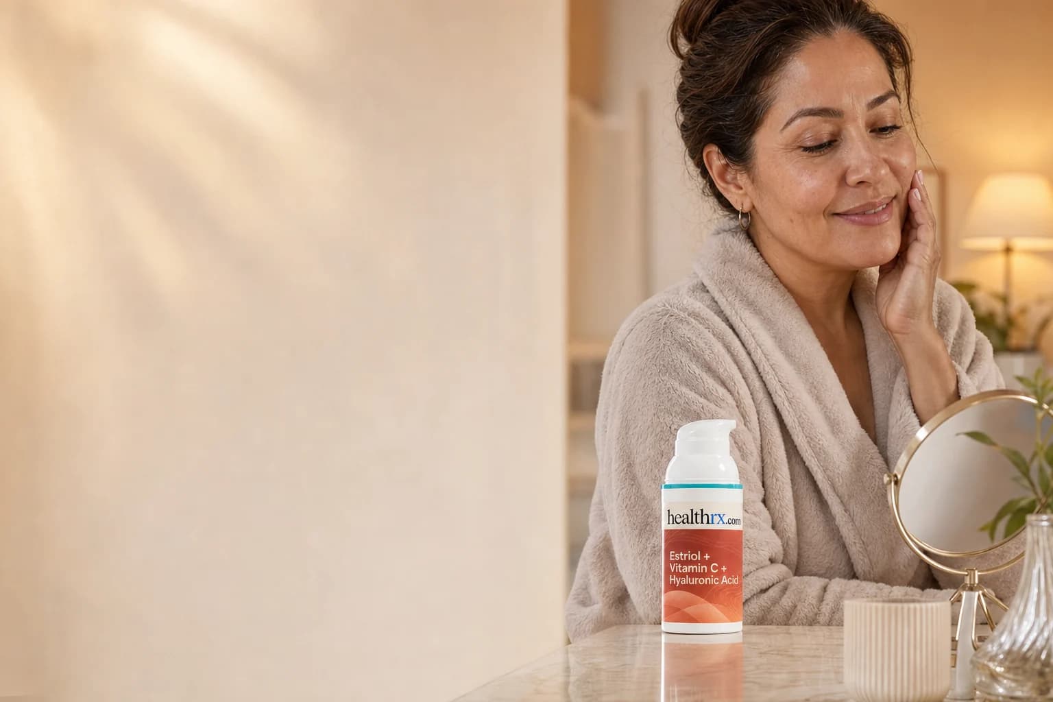 A woman in her early 50s during her evening skincare routine, with Estriol / Vitamin C / Hyaluronic Acid