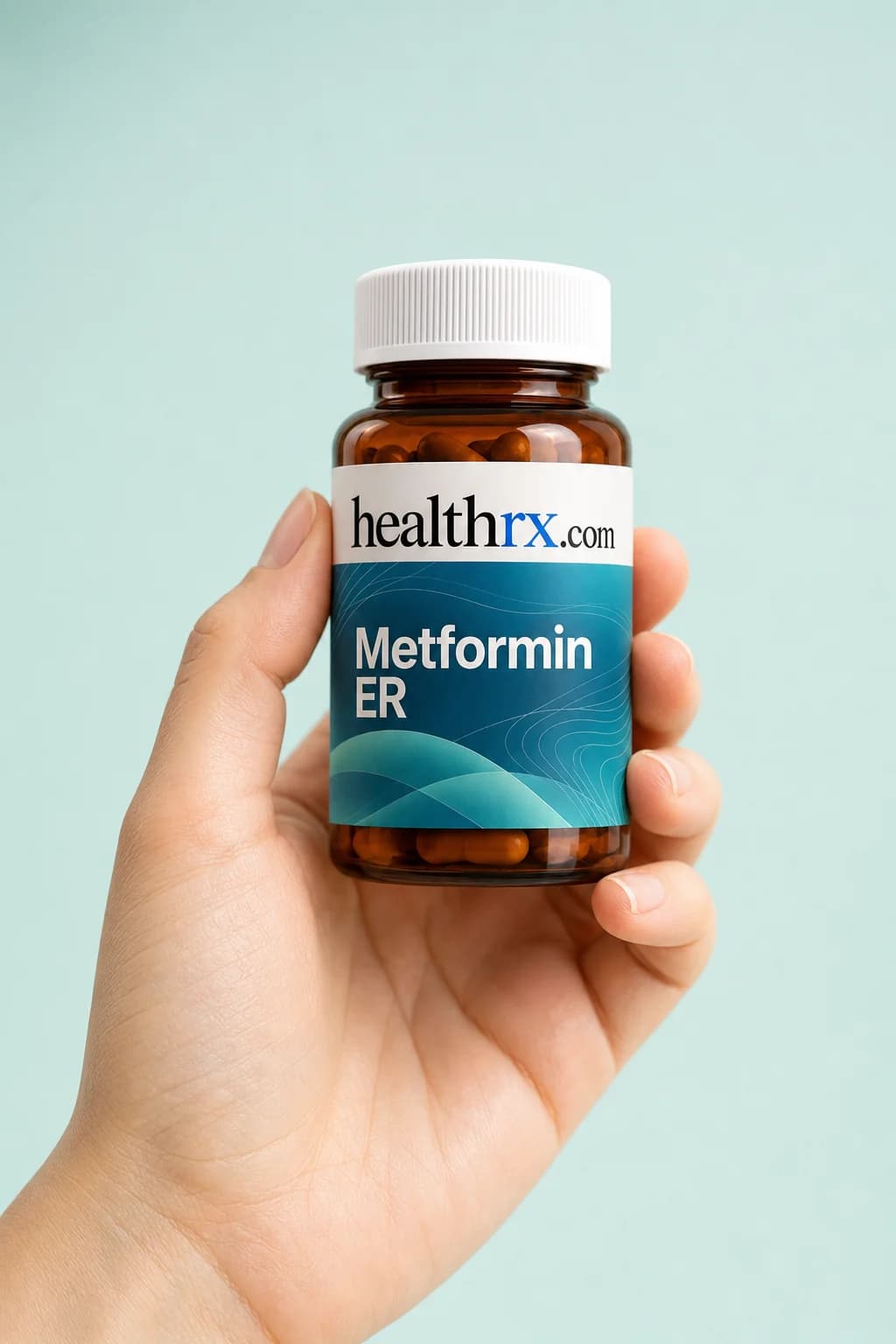 Metformin ER held in one hand, showing its size