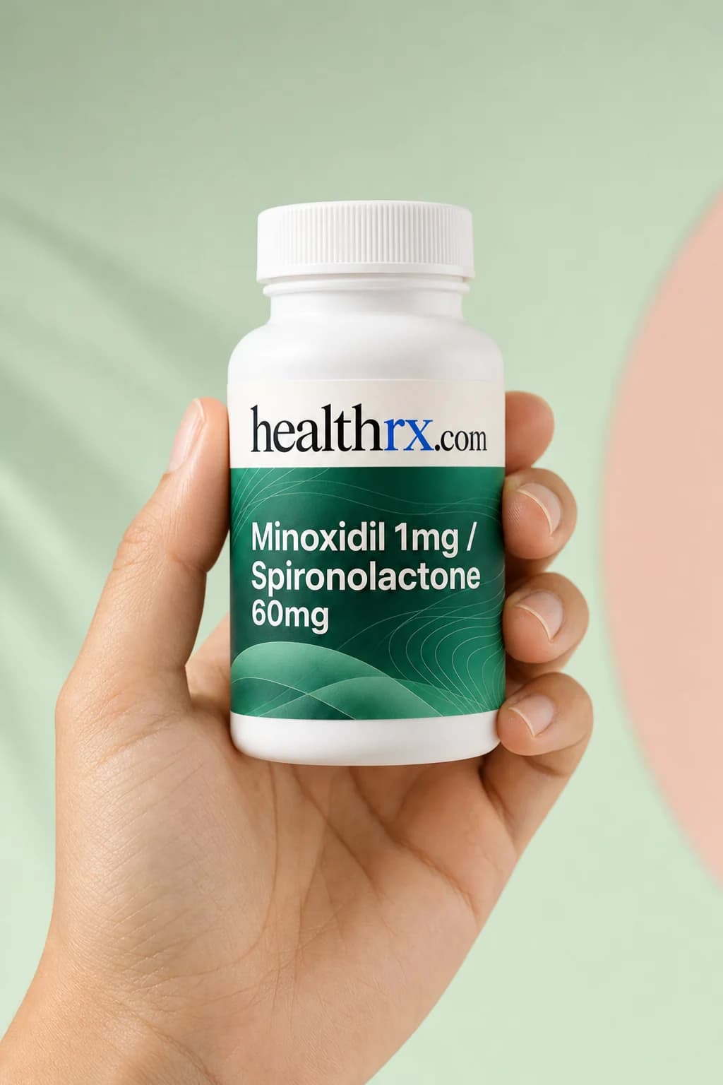 Minoxidil 1mg / Spironolactone 60mg held in one hand, showing its size