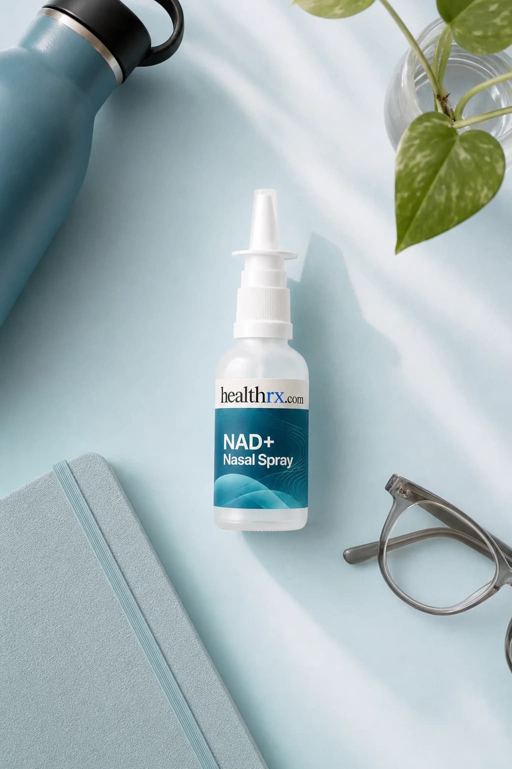 NAD+ Nasal Spray laid flat among everyday things