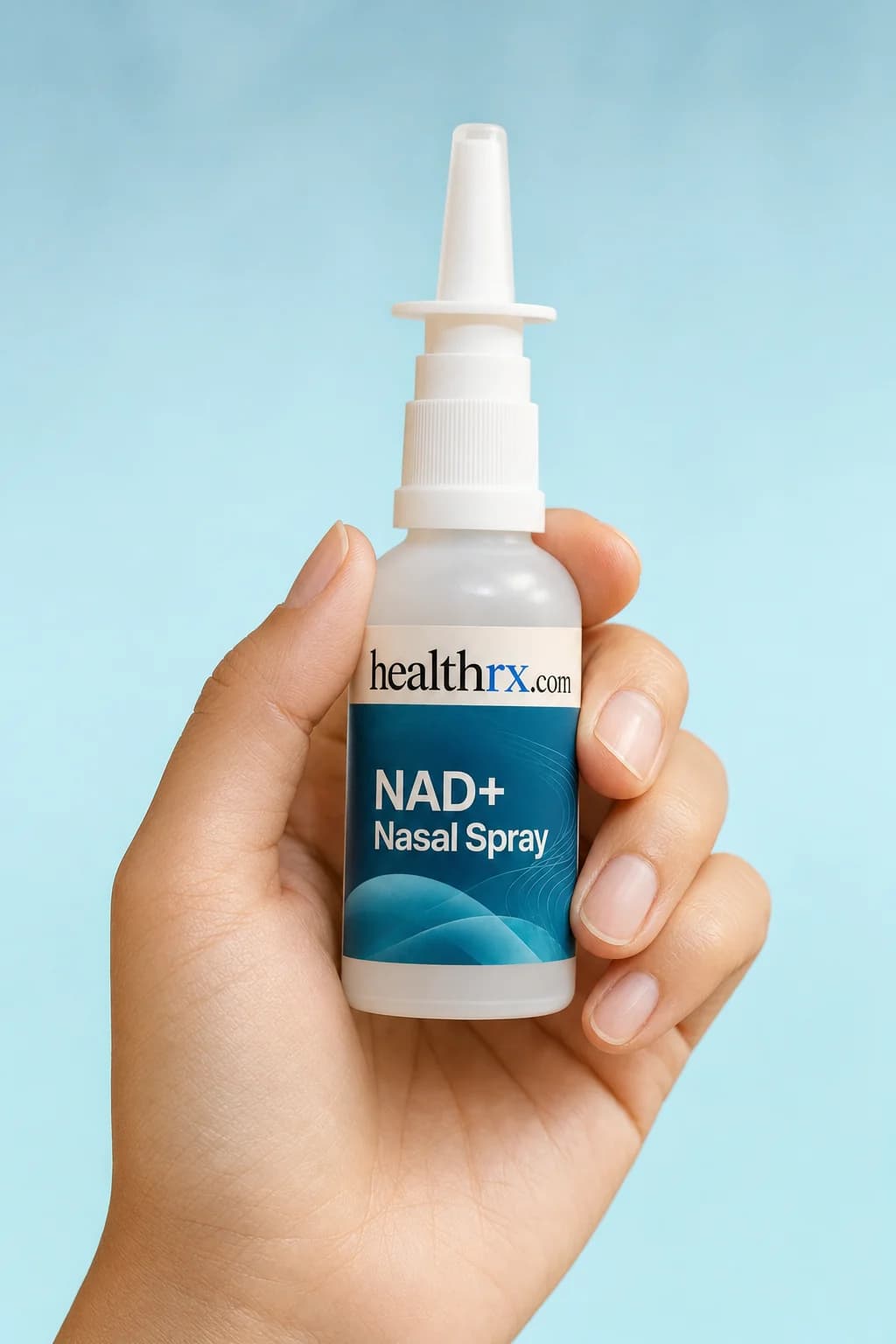 NAD+ Nasal Spray held in one hand, showing its size