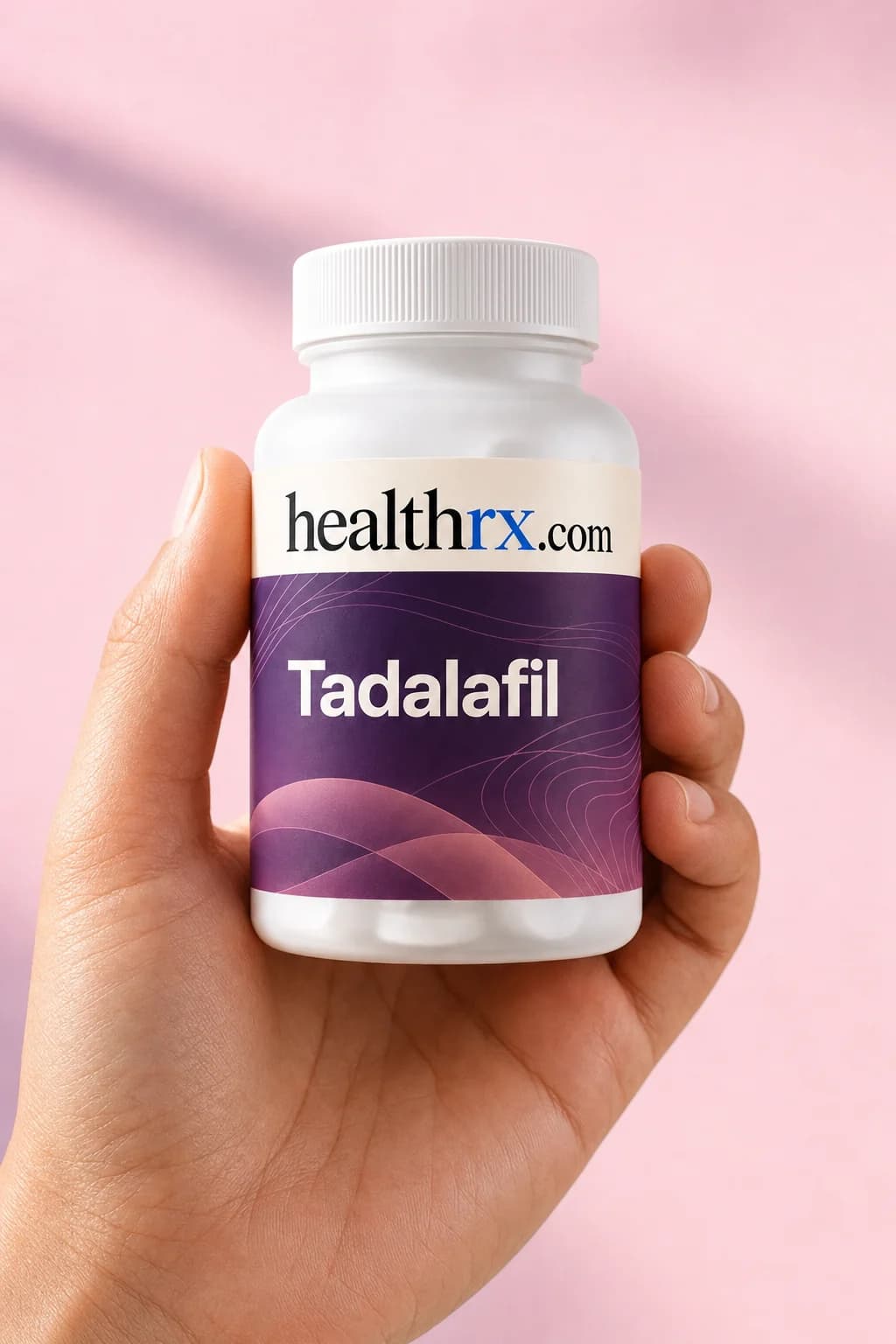 Tadalafil held in one hand, showing its size