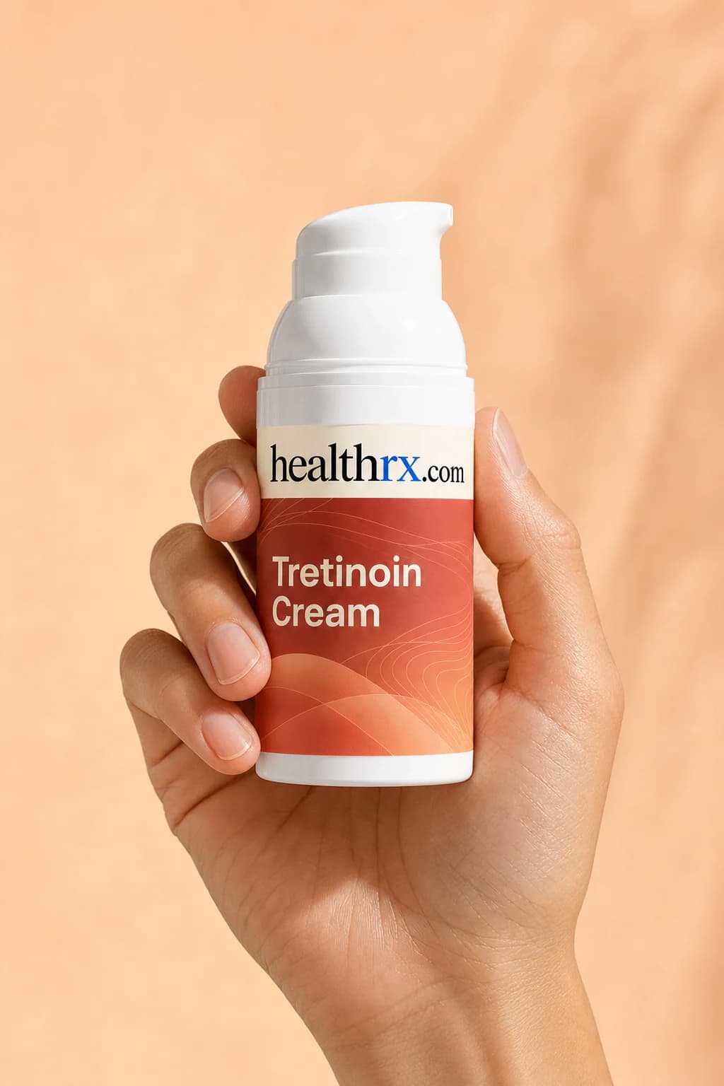Tretinoin Cream held in one hand, showing its size