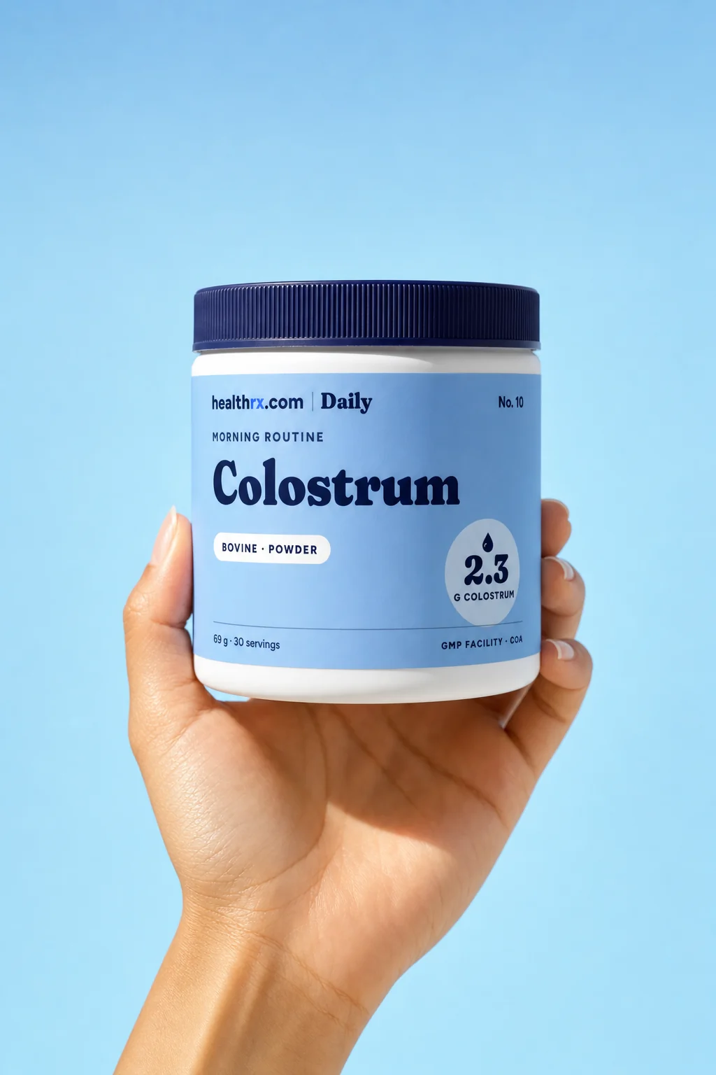 Colostrum Powder in a hand, showing its size