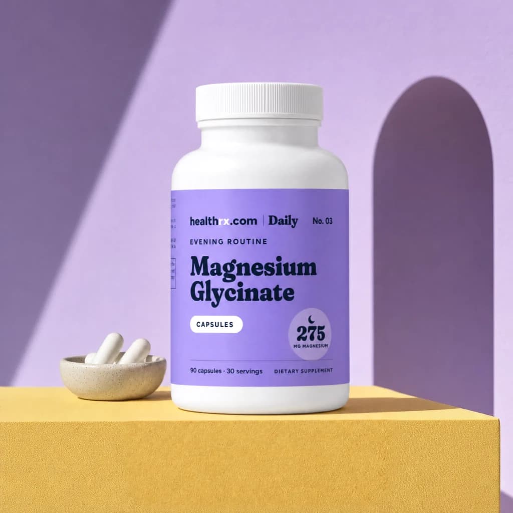 Magnesium Glycinate by HealthRX.com in its capsules packaging, on a colored pedestal
